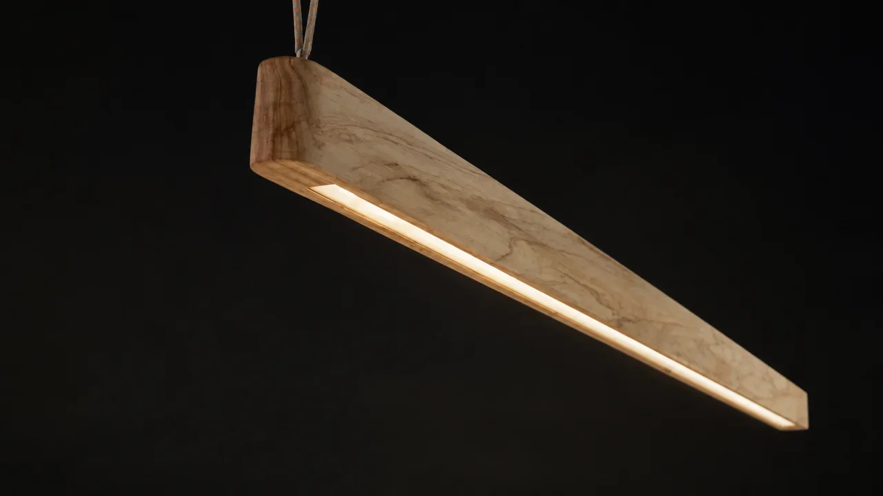 Original hero reference showing figured timber and the recessed illuminated strip.